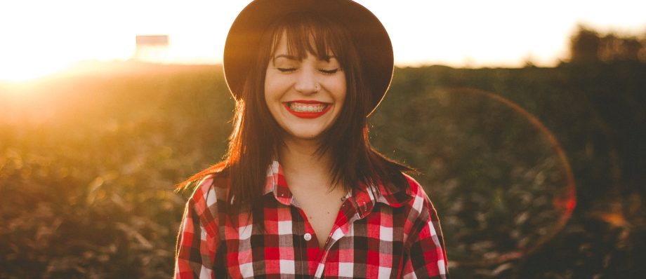 woman experiencing joy in an open field